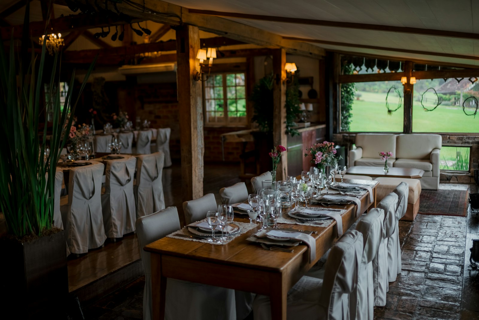 Warm dining room with wooden tables and soft evening light